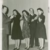 Two men and three women of the Home Defense Unit with guns