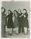 Two men and three women of the Home Defense Unit with guns