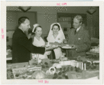 Hall of Pharmacy - Models - Officials with Red Cross nurses examining model