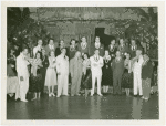 Hawaiian Day - Men, women and hula dancers with leis