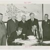 Iceland Participation - Vihjamur Thor and Grover Whalen signing contracts, with others watching