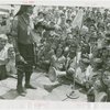 Indian (Native American) Participation - Hopi chief on stage surrounded by children