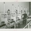 Infant Incubator - Men and women looking at babies in incubators
