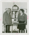 Infant Incubator - Martin Couney and woman looking at baby in incubator