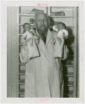 Infant Incubator - Martin Couney holding two babies