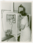Infant Incubator - Nurse with baby in incubator