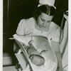 Infant Incubator - Nurse weighing baby