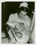Infant Incubator - Nurse weighing baby