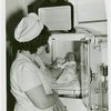 Infant Incubator - Nurse putting baby into incubator