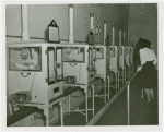 Infant Incubator - Woman looking at babies in incubators