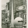 Information Booths - Workers building booth shaped like Trylon and Perisphere in Times Square