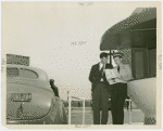 Information Booths - Men and women in front of booth shaped like Perisphere