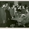 International Business Machines (IBM) - Woman demonstrates card punching machine to group of girls