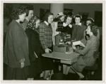 International Business Machines (IBM) - Woman demonstrates card punching machine to group of girls