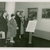 International Business Machines (IBM) - Men and women looking at art
