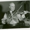 Iraq Participation - Man playing instrument