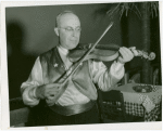 Iraq Participation - Man playing instrument