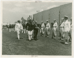 Ireland Participation - Robert Brennan and group walk in front of military