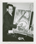 Jewels - Man holding jewel in front of World's Fair poster