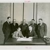 Labor - W.H. Locke Anderson (President, U.S. Potter's Association) signs contract while officials look on