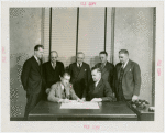 Labor - W.H. Locke Anderson (President, U.S. Potter's Association) signs contract while officials look on