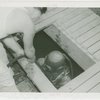 Lagoon of Nations - Navy diver going into pool to repair piping
