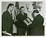 LaGuardia, Fiorello, H. - Looking at photos