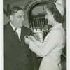 LaGuardia, Fiorello, H. - Decoration Ceremonies - American Airlines hostess pinning on emblem