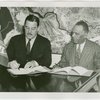 Liberia Participation - Grover Whalen and Walter F. Walker signing contract