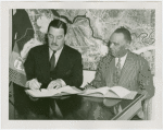 Liberia Participation - Grover Whalen and Walter F. Walker signing contract