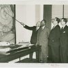 Liberia Participation - Grover Whalen, Walter F. Walker and group looking at the location for Liberia exhibit
