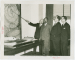 Liberia Participation - Grover Whalen, Walter F. Walker and group looking at the location for Liberia exhibit