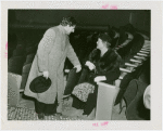 Mrs. Pratt and man at Music Hall