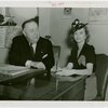 Isabel Caldwell McDougal with man at desk