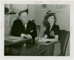 Isabel Caldwell McDougal with man at desk