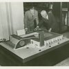 Man Building - Walter Hoving (Lord and Taylor) and John Starbuck look at model