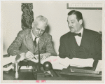 Man Building - Grover Whalen and John Starbuck at contract signing