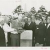 Man Building - Grover Whalen and group laying cornerstone