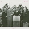 Man Building - Grover Whalen and group laying cornerstone