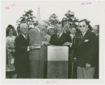Man Building - Grover Whalen and group laying cornerstone