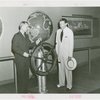 Marine - Admiral Land steers ship wheel