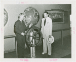 Marine - Admiral Land steers ship wheel