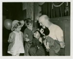 Marionettes - Man showing marionettes to boy and girl