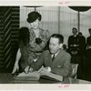 Maryland Day - Herbert O'Connor (Governor) signing guestbook while his wife look on