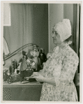 Massachusetts Day - Woman holding doll