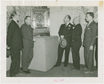 Medicine and Public Health - Men standing next to mechanical heart