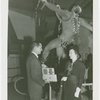 Medicine and Public Health - Man presenting radio to 100,000th visitor to Bayer Aspirin exhibit