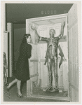 Medicine and Public Health - Woman looking at model of transparent man
