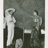 Mexico Participation - Woman showing Aztec calendar to man who walked from Mexico City to Fair