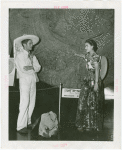 Mexico Participation - Woman showing Aztec calendar to man who walked from Mexico City to Fair
